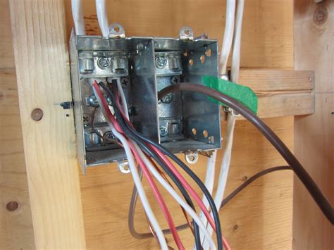 mixing line and low voltage wires in junction box|separating high and low voltage in same box.